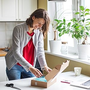 Happy lady opening box